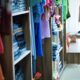 Vibrant and neatly arranged clothing in a Brazilian fashion store, showcasing diverse styles.