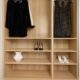 A minimalist wardrobe showcasing elegant dresses and stylish heels, emphasizing simplicity and elegance.