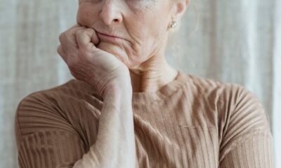 Portrait of a serious senior woman in a thoughtful pose indoors.