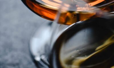 Elegant close-up shot of whiskey glasses showcasing warm tones and reflections.