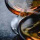 Elegant close-up shot of whiskey glasses showcasing warm tones and reflections.