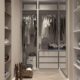 Stylish walk-in closet with neutral tones and contemporary design elements.