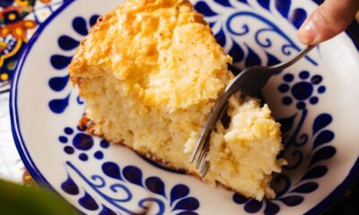A delectable Mexican corn cake slice served on a traditional pattern plate, showcasing vibrant colors and inviting textures.